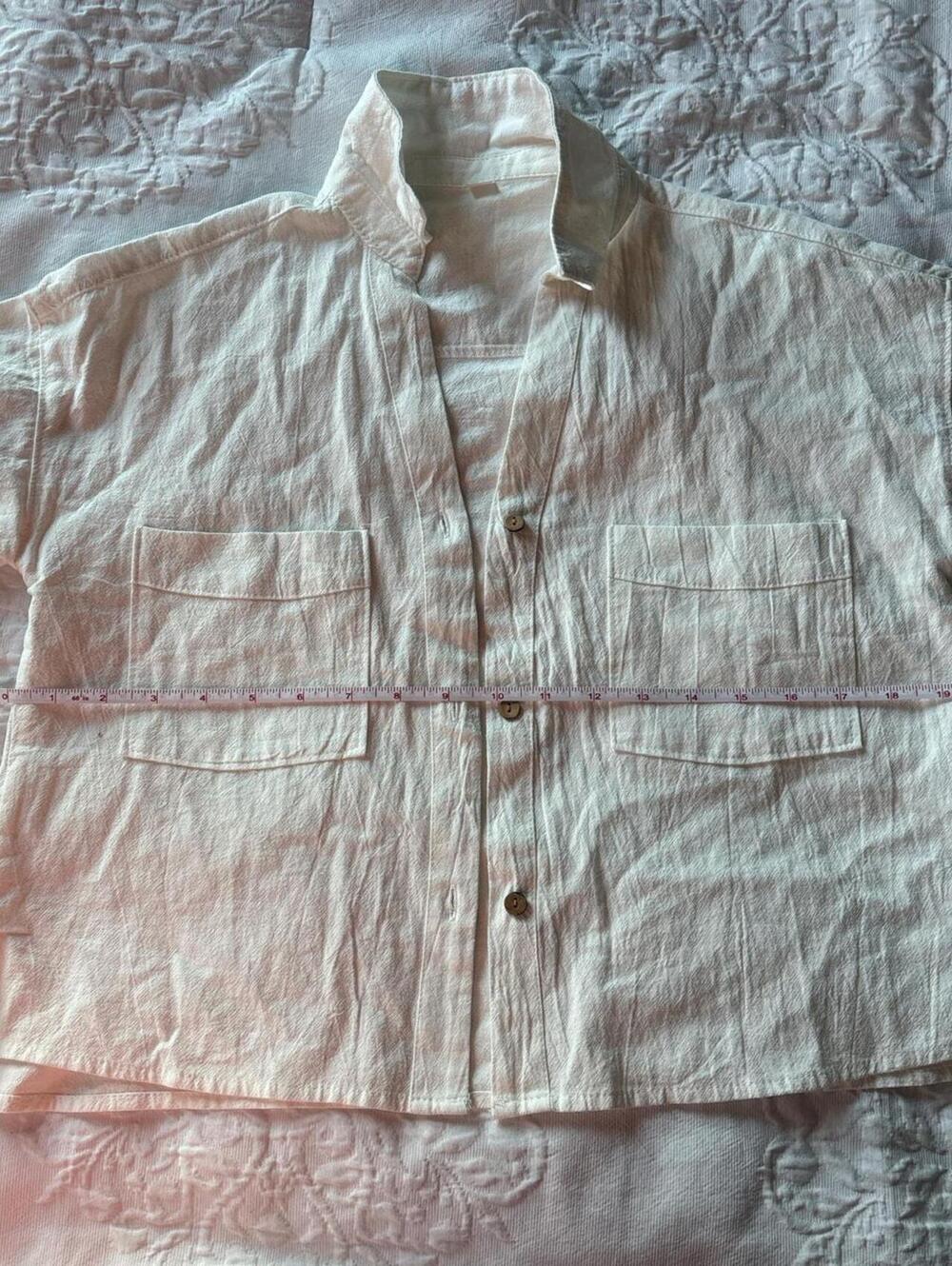 White button-up shirt with a relaxed fit